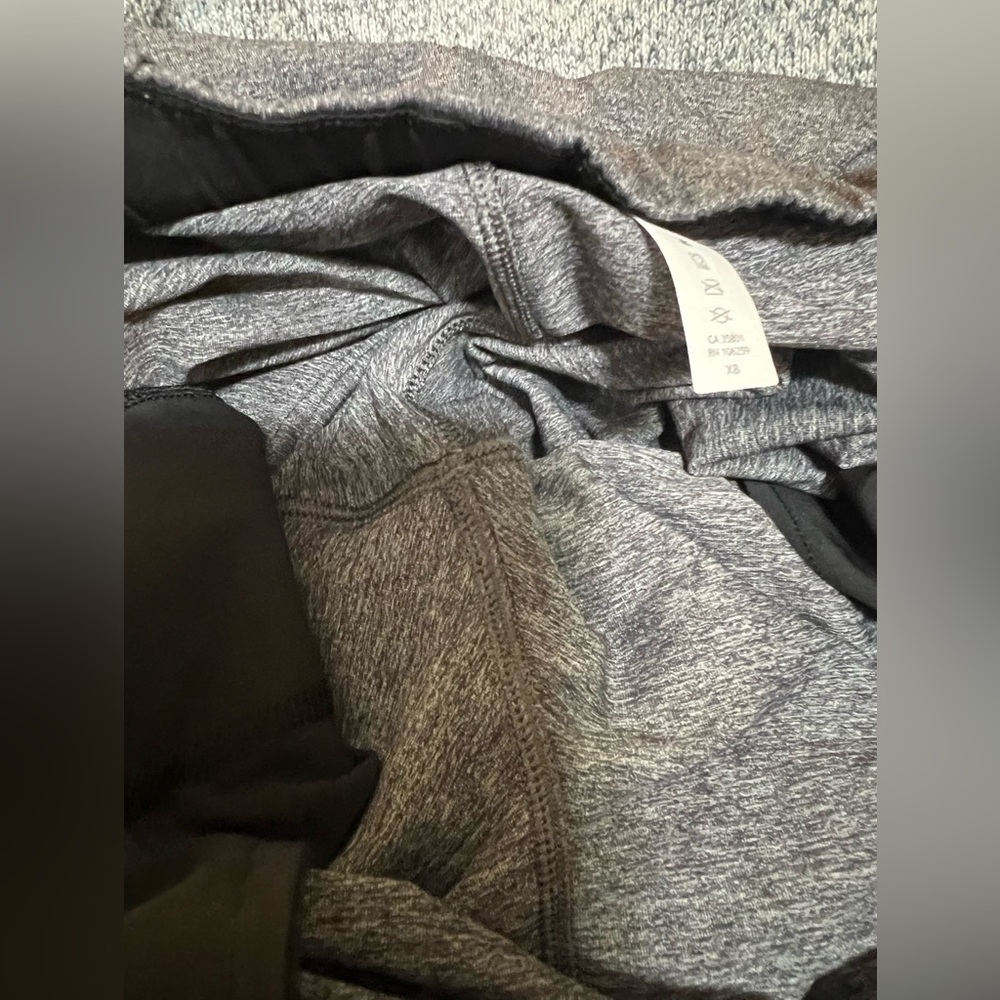 12. Lululemon On The Fly Pant *27" Heathered Black - Picture 16 of 16
